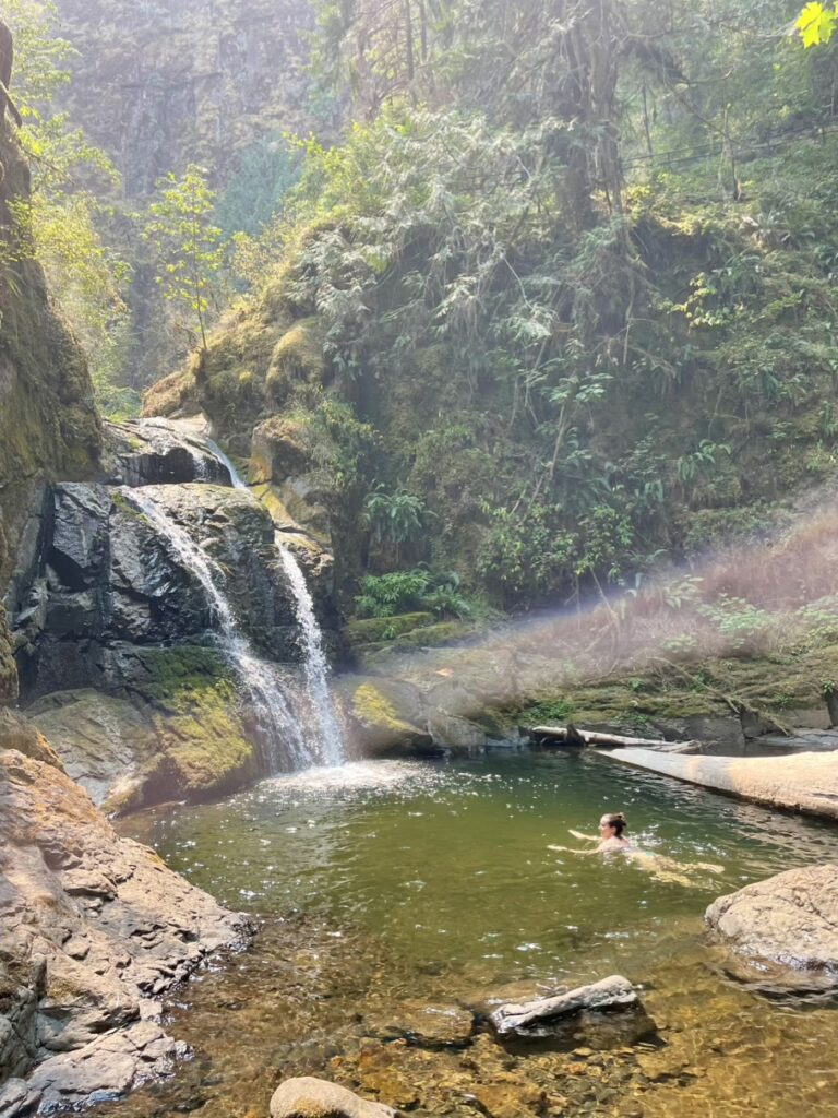 Me swimming under a waterfall in the Umpqua National Forest